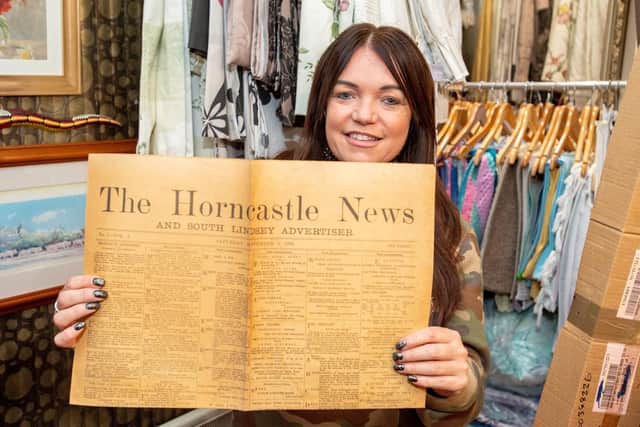Thrifty’s owner Julie Clark with the historic copy of the Horncastle News.