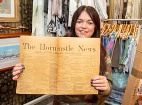 Thrifty’s owner Julie Clark with the historic copy of the Horncastle News.