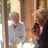 Relatives enjoy a window chat at Ashdene Care Home. Photo: Michael Hunt EMN-200911-173454001