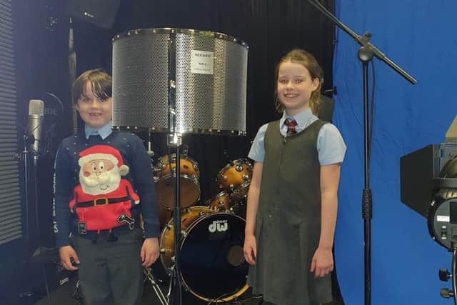 Esme and Isaac, recording at Street Star Live studios for the Christmas song. EMN-201116-112227001