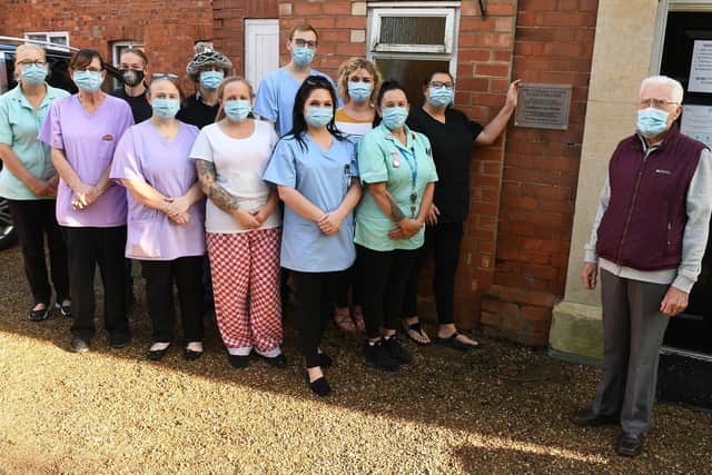 Plaque presented to Ashdene Care Home. L-R Dorinda Hawkins, Rosemary Wainwright, Jon Clayton, Claire Atkinson, Michael Hunt, Carla Garriock, Luke McCarthy, Lauren Smith, Laura Cook, Sandy Clarke, Jilly Hunt and Lewis Shaw who presented the plaque. EMN-201011-130916001