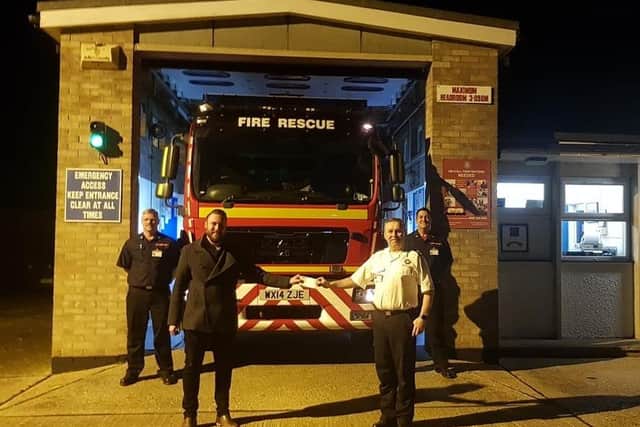 Members of Binbrook fire crew gratefully accepted the donation on behalf of the Firefighters Charity