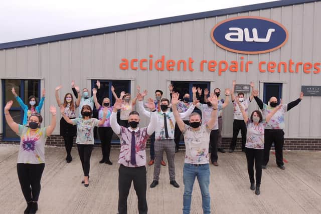 Staff at AW Repair Centre in Sleaford helped raise money and awareness with a rainbow day for Rainbow Stars and Children in Need. EMN-201113-171908001