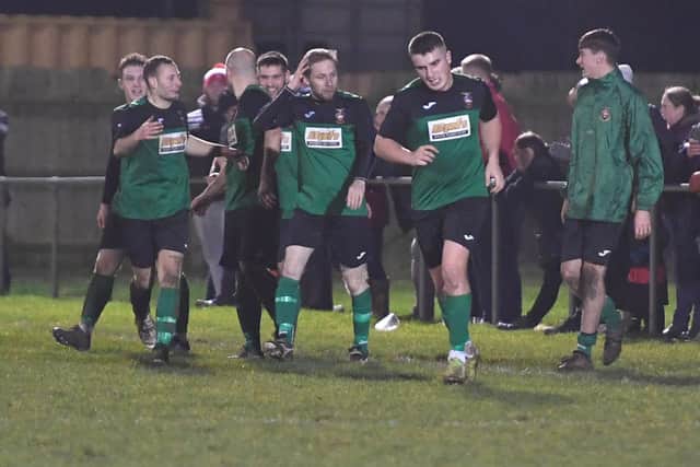 Sam Jackson, left, celebrates a Sleaford goal against Boston last season.