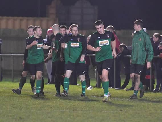 Sam Jackson, left, celebrates a Sleaford goal against Boston last season.