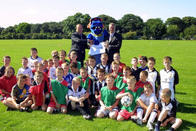 The 2002 summer soccer group in Skegness is pictured with Ray Clemence a(back right) and the then ELDC vice-chairman Coun Brian Burnett, plus Al the Alligator, as they re-launch the Key Card sports scheme throughout the Active Leisure centres in East Lindsey.