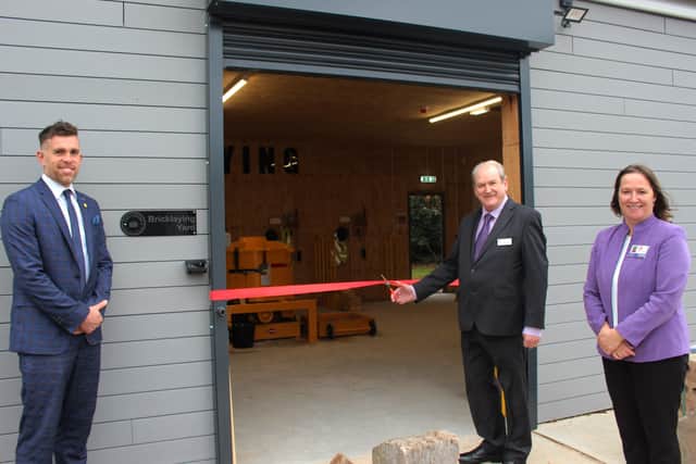 Chairman of the governors Graham Arnold opens the new facility, alongside academy principal Laranya Caslin and teacher Tom Mitchell.
