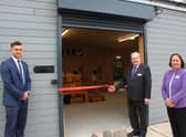 Chairman of the governors Graham Arnold opens the new facility, alongside academy principal Laranya Caslin and teacher Tom Mitchell.