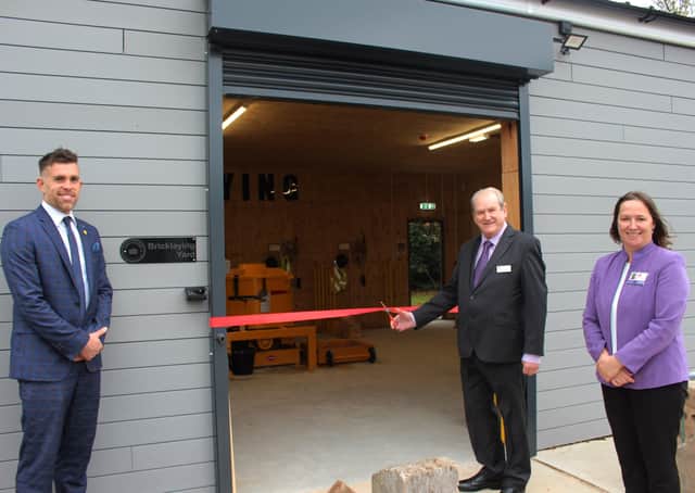 Chairman of the governors Graham Arnold opens the new facility, alongside academy principal Laranya Caslin and teacher Tom Mitchell.