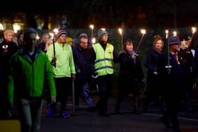 Richard Pullen in last year's torchlit procession. EMN-201118-182416001