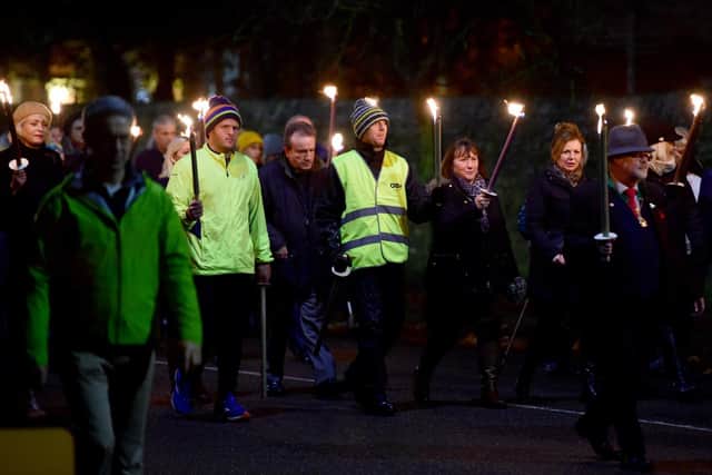 Richard Pullen in last year's torchlit procession. EMN-201118-182416001
