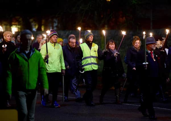 Richard Pullen in last year's torchlit procession. EMN-201118-182416001