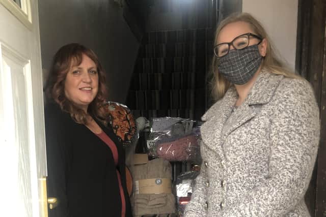 Charlotte presents the prize to Pat in a picture taken before the latest lockdown.