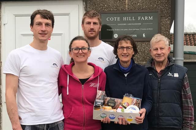 From left: Joe, Laura, Ross, Mary, and Michael Davenport, owners of Cote Hill Cheese, with one of their Christmas hampers.
