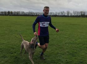 Paul Moss running with his dog Ivy. EMN-201120-170039001
