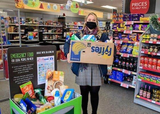 Lincolnshire Co-op’s Community Coordinator Laura Worsley collecting shoppers’ donations. Picture: Chris Vaughan Photography EMN-201125-175539001