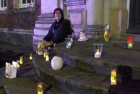 Illuminated lantern festival in Boston, celebrating 400th anniversary of the Pilgrim story.  Trustee and volunteer at Fydell House Sue Morrison, with lanterns at Fydell House. EMN-201127-130521005