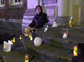 Illuminated lantern festival in Boston, celebrating 400th anniversary of the Pilgrim story.  Trustee and volunteer at Fydell House Sue Morrison, with lanterns at Fydell House. EMN-201127-130521005