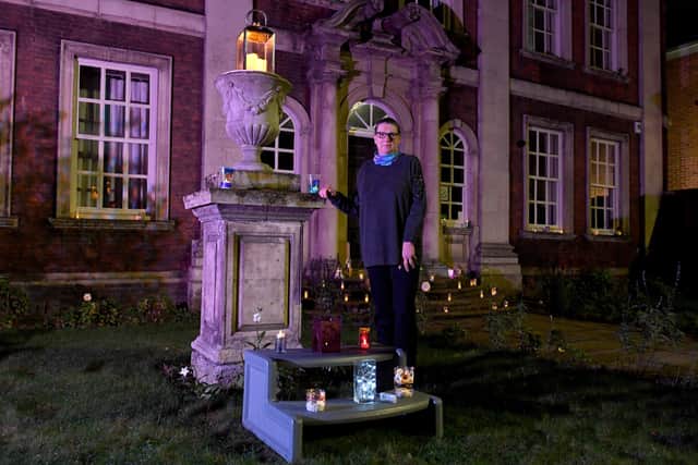Illuminated lantern festival in Boston, celebrating 400th anniversary of the Pilgrim story. Operations manager at Fydell House, Pat Collingwood with lanterns at fydell House. EMN-201127-130543005