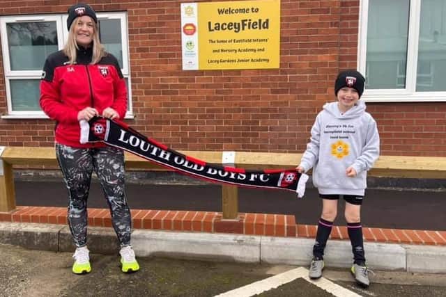 Jimmy, with his Louth Old Boys hat and scarf, alongside Sophie Archer (Teaching Assistant at LaceyField) before his run. EMN-200412-115052001