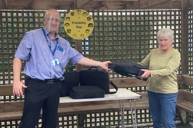Spilsby U3A present laptops to headteacher Andrew Leeman.