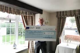 David Smith, owner of Bacchus Hotel, with the cheque
