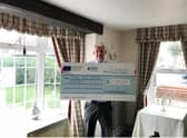 David Smith, owner of Bacchus Hotel, with the cheque