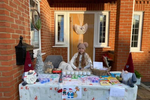 Belle at her table sale to raise funds for a pony.
