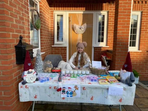 Belle at her table sale to raise funds for a pony.