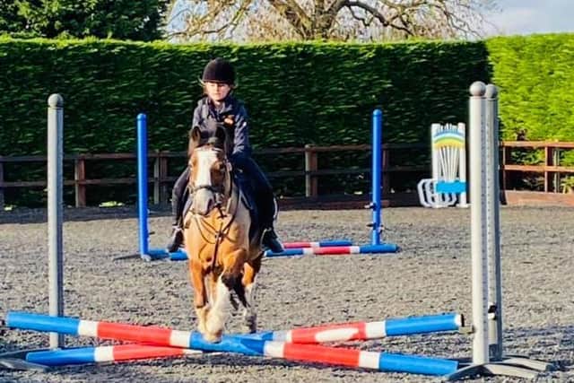 Belle riding a pony at Equiclass EC Friskney.