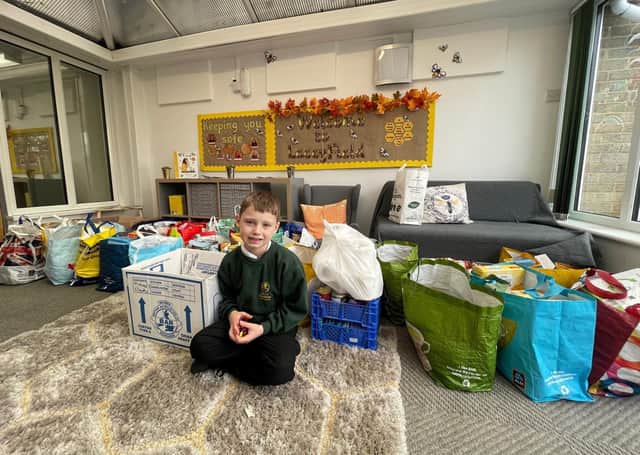 Jimmy with some of the donations made to the LaceyField food bank. EMN-200412-115041001