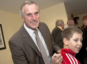 Ray Clemence signs the top of Connor Wall, 10.
