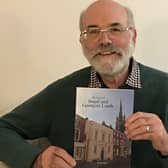 Dr Richard Gurnham with a copy of his brand new book