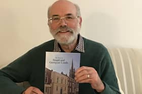 Dr Richard Gurnham with a copy of his brand new book
