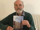 Dr Richard Gurnham with a copy of his brand new book
