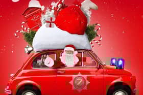 Sleaford firefighters' drive through Santa's Grotto. EMN-201214-112242001