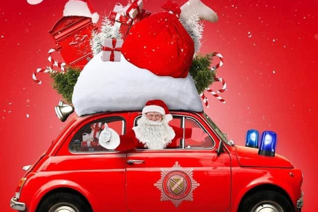 Sleaford firefighters' drive through Santa's Grotto. EMN-201214-112242001