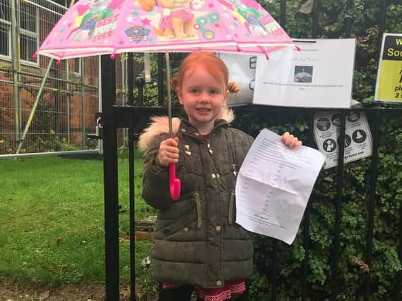 Caythorpe primary school pupil Isla Armitage, 5, starts the Christmas treasure hunt at the school.