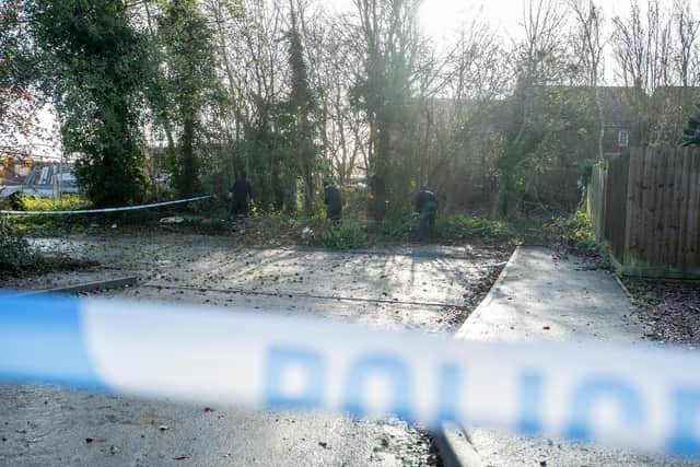 Officers search near where Roberts' body was found