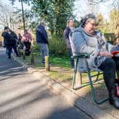 The waiting game - this photo of queues at the pharmacy was taken in the summer when it least the sun was shining