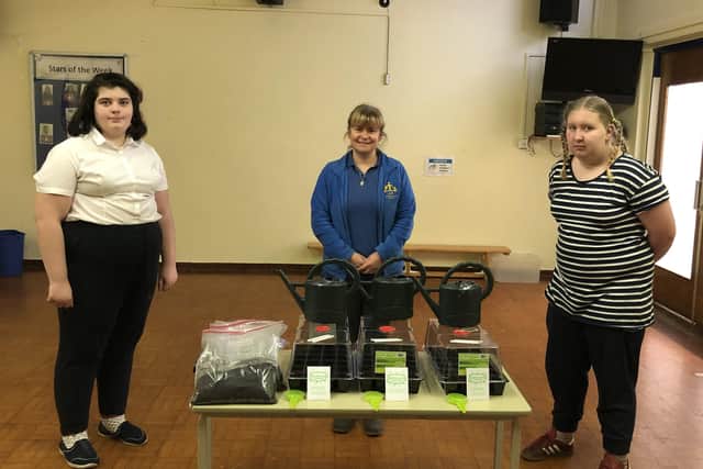 Members of the St Bernard’s School community with the growing kits.