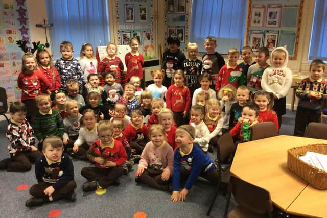 Reception pupils on their first Christmas Jumper Day with teachers Megan Tory and Becky Sharpe