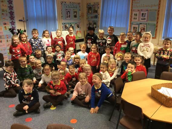 Reception pupils on their first Christmas Jumper Day with teachers Megan Tory and Becky Sharpe