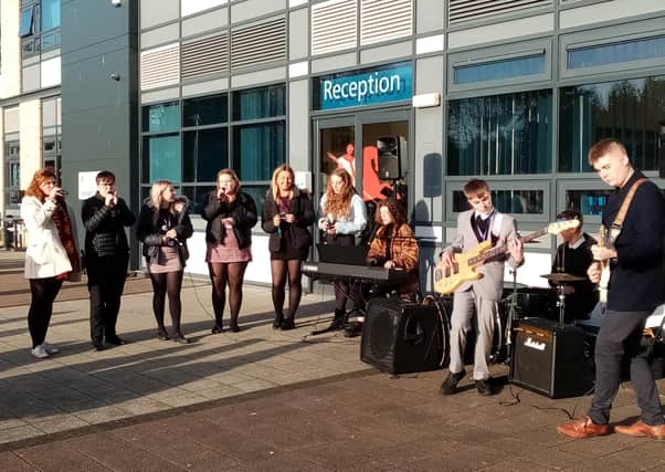 The St George's Academy sixth form musicians performing musical handwashing at Sleaford campus. EMN-201219-154631001