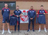 Members of the Horncastle Town management team show off this season's managers' kit, sponsored by Shinn Developments.