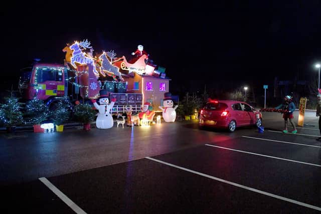 Santa's drive-through grotto at Sleaford fire station, for Firefighters Charity. EMN-201217-180027001