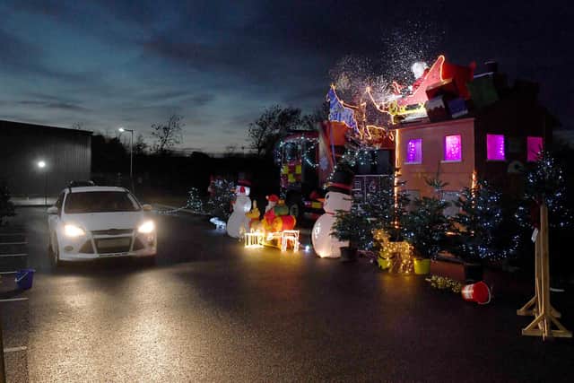 Santa's drive-through grotto at Sleaford fire station, for Firefighters Charity. EMN-201217-180049001