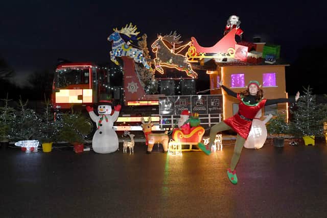 Santa's drive-through grotto at Sleaford fire station, for Firefighters Charity. Maisie McMahon - community fire safety advocate for Sleaford Station. EMN-201217-180100001