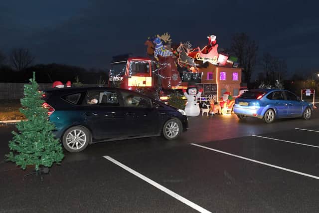Santa's drive-through grotto at Sleaford fire station, for Firefighters Charity. EMN-201217-180124001