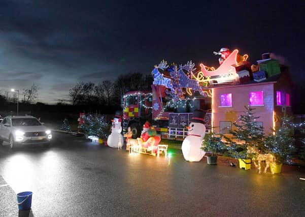Santa's drive-through grotto at Sleaford fire station, for Firefighters Charity. EMN-201217-180038001